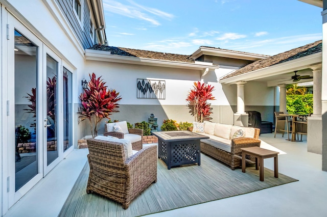 exterior space featuring french doors and an outdoor living space with a fire pit