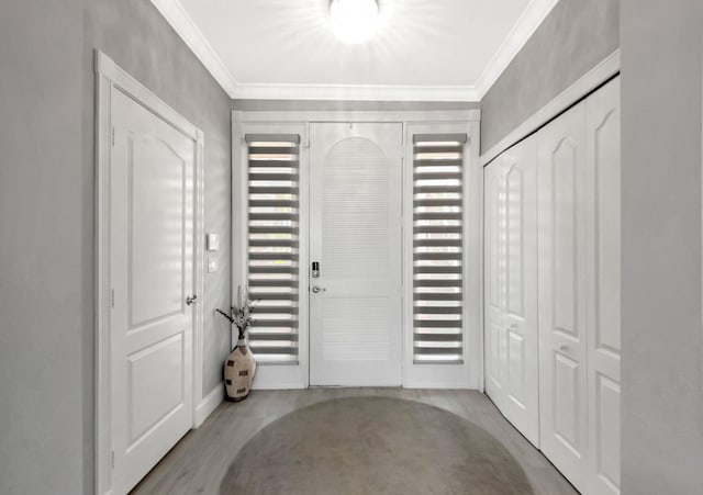 foyer featuring ornamental molding and light hardwood / wood-style floors