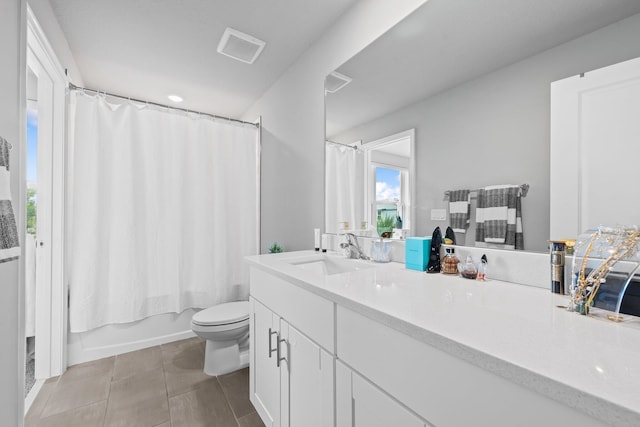 full bathroom with tile patterned flooring, vanity, shower / bathtub combination with curtain, and toilet