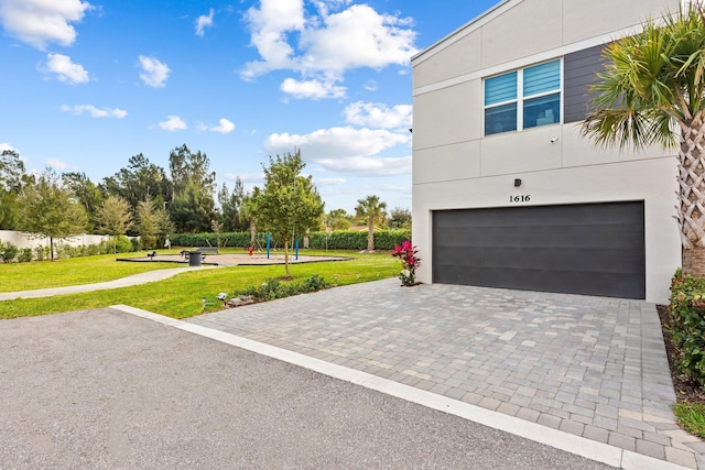 garage featuring a yard