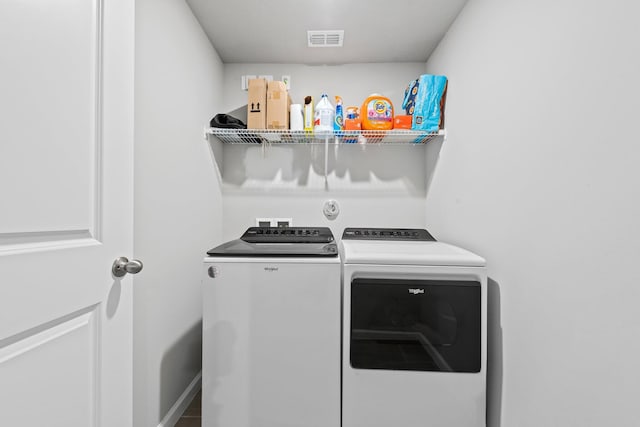 laundry area featuring independent washer and dryer