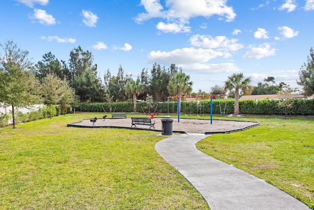 view of home's community with a yard and a playground