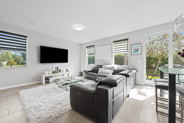 living room with light tile patterned floors