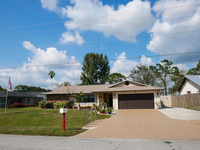 ranch-style home featuring a garage and a front lawn