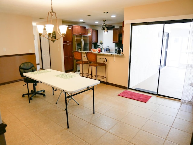 interior space featuring an inviting chandelier and light tile patterned floors