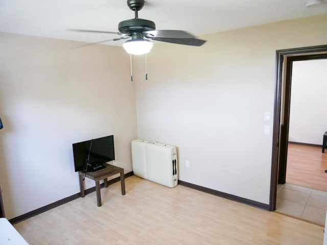 interior space with ceiling fan and light wood-type flooring