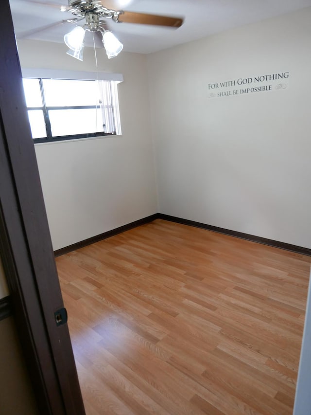 unfurnished room featuring ceiling fan and light hardwood / wood-style flooring