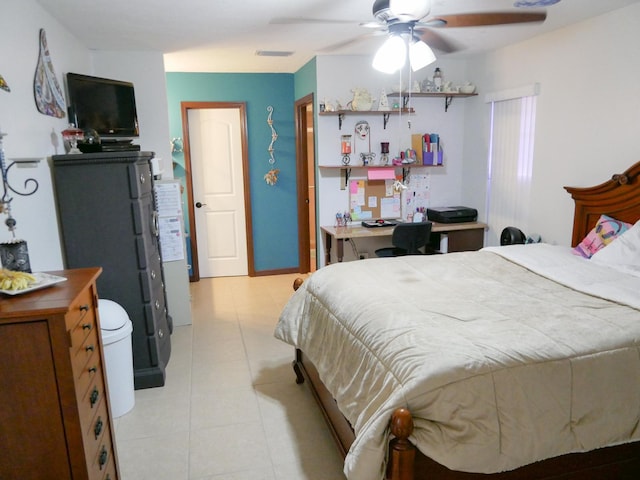 bedroom with ceiling fan and light tile patterned floors