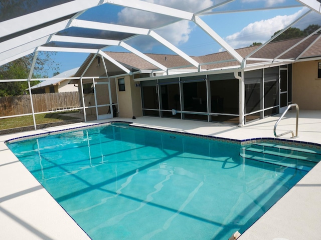 view of pool with a lanai and a patio area