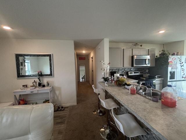 kitchen featuring appliances with stainless steel finishes and backsplash