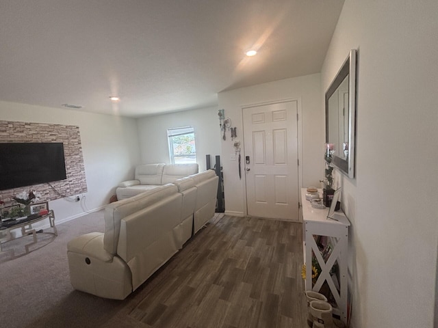 living room with dark hardwood / wood-style flooring