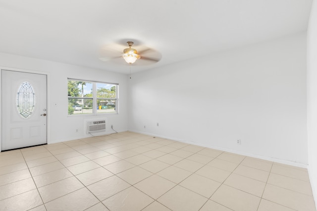 foyer with ceiling fan, a wall mounted AC, and light tile patterned flooring