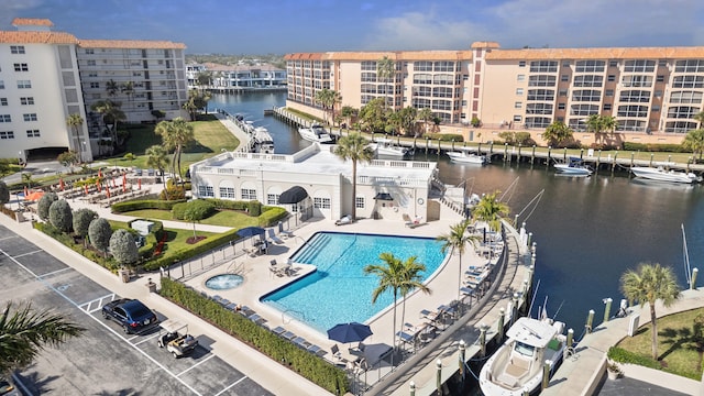 birds eye view of property with a water view