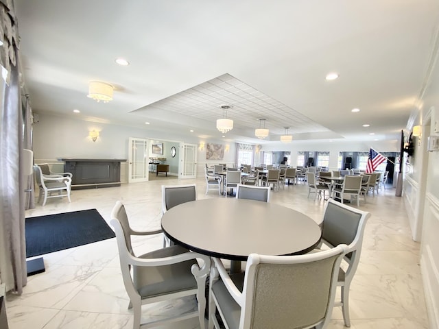 dining area featuring a tray ceiling