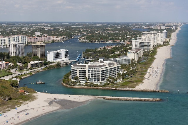 drone / aerial view featuring a view of the beach and a water view