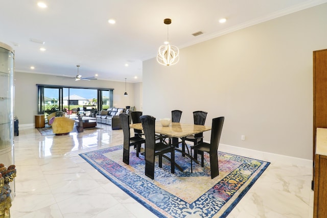 dining area with crown molding and ceiling fan with notable chandelier