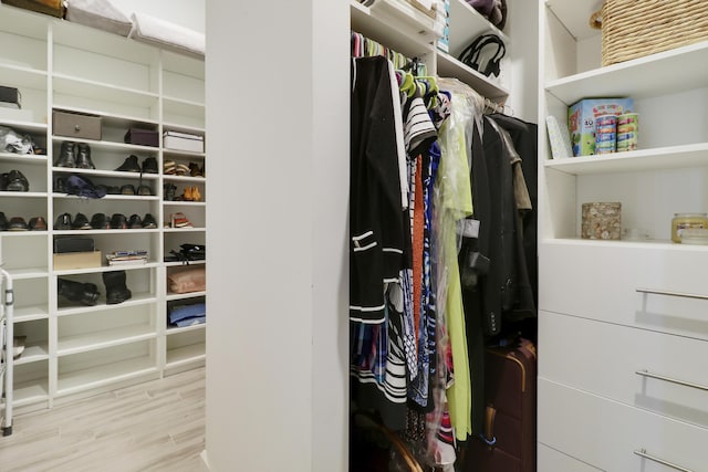 walk in closet featuring light hardwood / wood-style floors