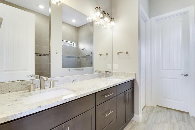 bathroom with vanity and a shower