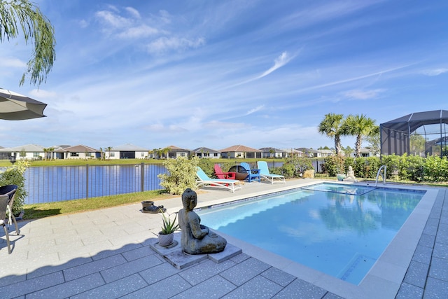 view of pool featuring a patio and a water view