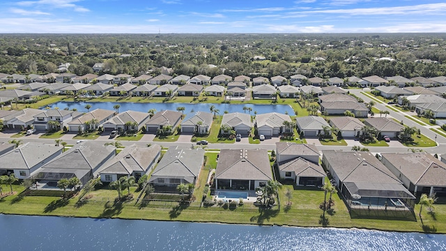 birds eye view of property with a water view