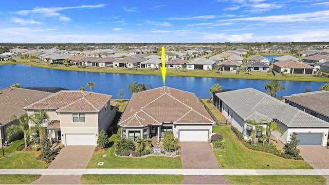 birds eye view of property featuring a water view