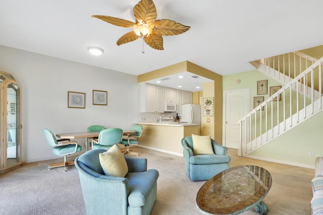 living room with light carpet and ceiling fan