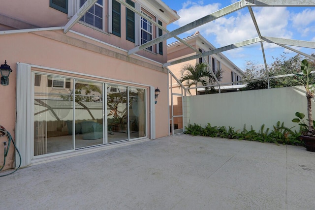 view of patio with a lanai