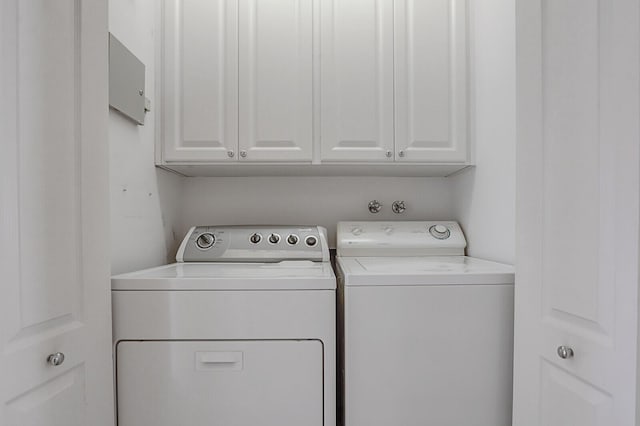 laundry area featuring cabinets and washer and dryer