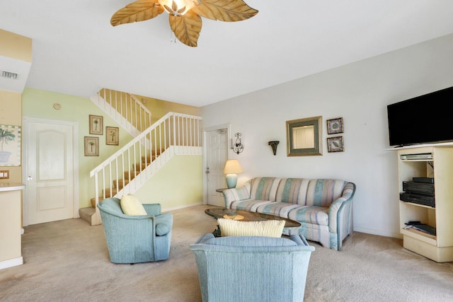 living room featuring ceiling fan and light carpet