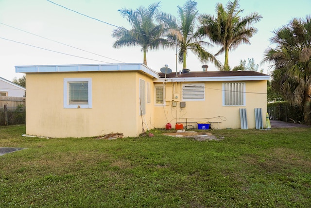 back of house with a yard