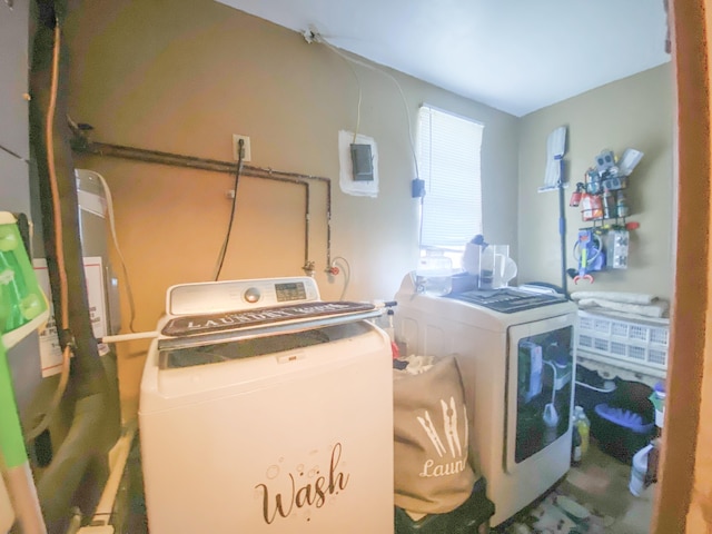 washroom featuring washer and clothes dryer