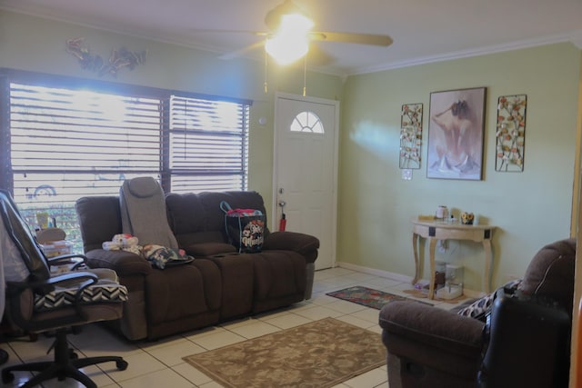 tiled living room with ornamental molding and ceiling fan