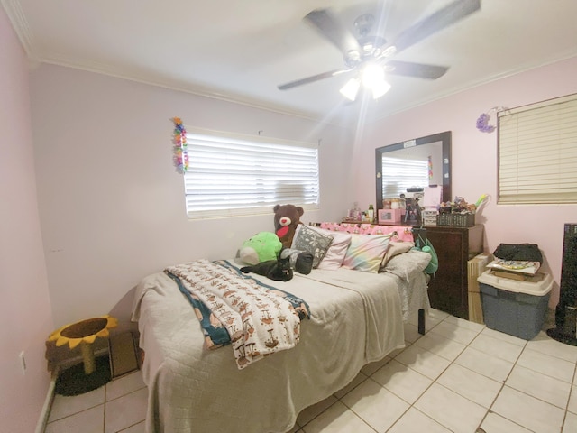 bedroom featuring crown molding, light tile patterned floors, and ceiling fan