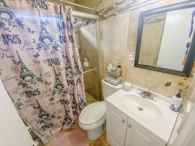 bathroom with vanity, toilet, and a shower with shower curtain