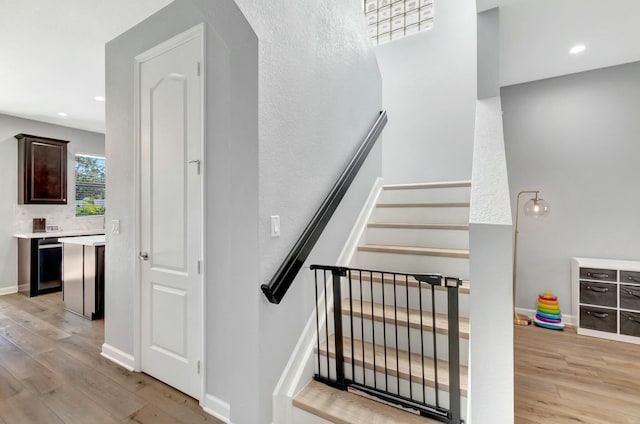 stairs with wood-type flooring