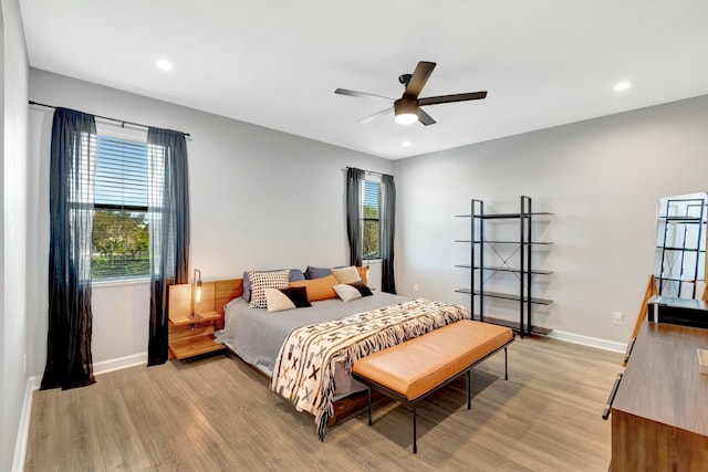 bedroom featuring ceiling fan and light hardwood / wood-style floors