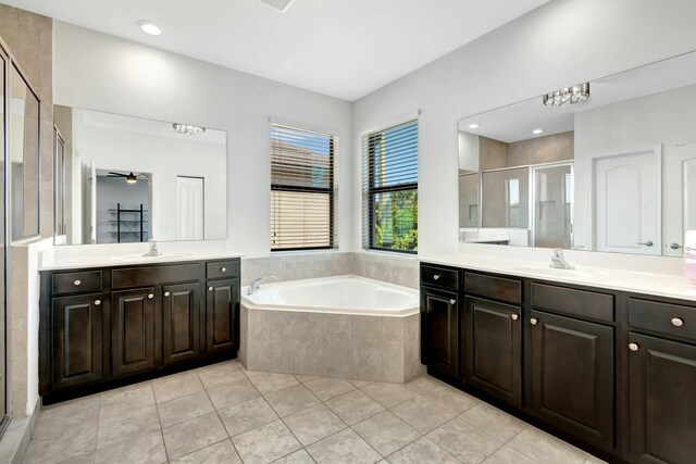 bathroom with vanity, independent shower and bath, and tile patterned flooring