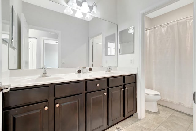 full bathroom featuring tile patterned floors, vanity, toilet, and shower / bath combo with shower curtain