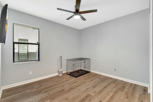 spare room with ceiling fan and light hardwood / wood-style flooring