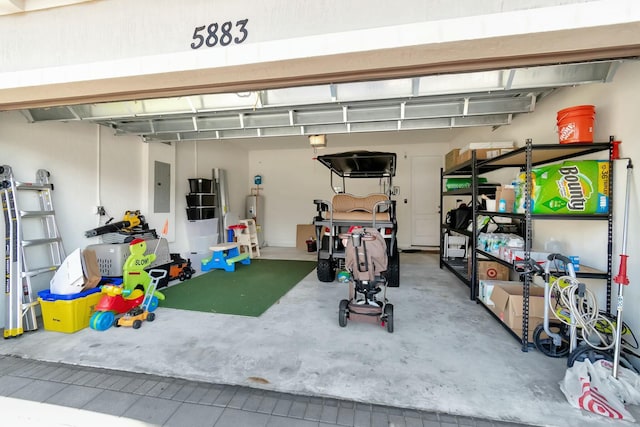 garage with water heater and electric panel