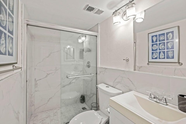 bathroom featuring vanity, tile walls, toilet, and walk in shower