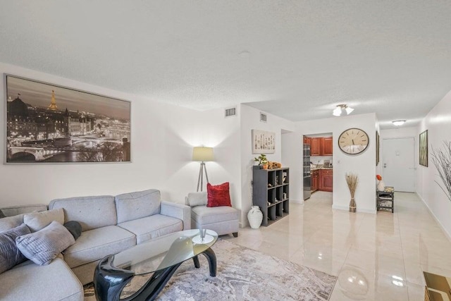 living room with a textured ceiling