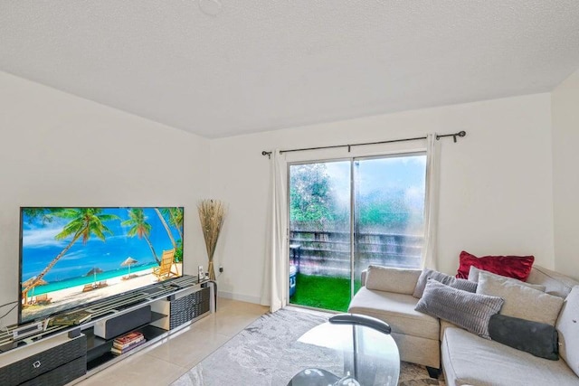 living room featuring light tile patterned floors and a textured ceiling