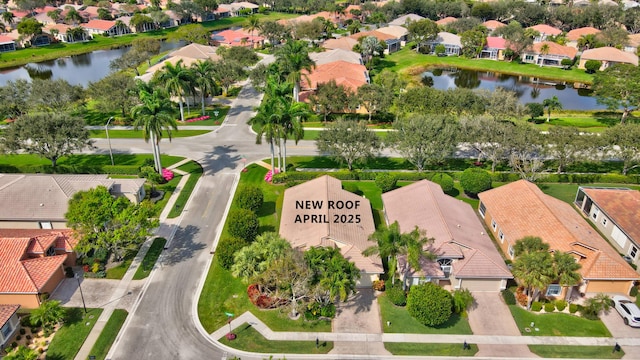 aerial view featuring a residential view and a water view