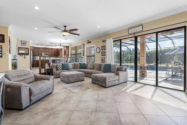 tiled living room featuring ornamental molding, ceiling fan, and a textured ceiling