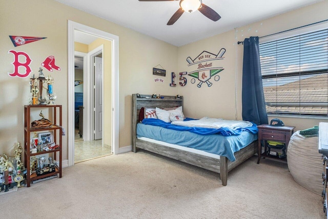 bedroom featuring ceiling fan and light carpet