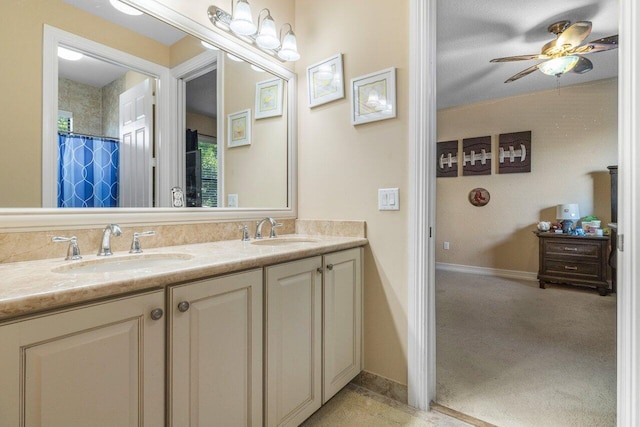 bathroom featuring vanity, ceiling fan, and a shower with curtain