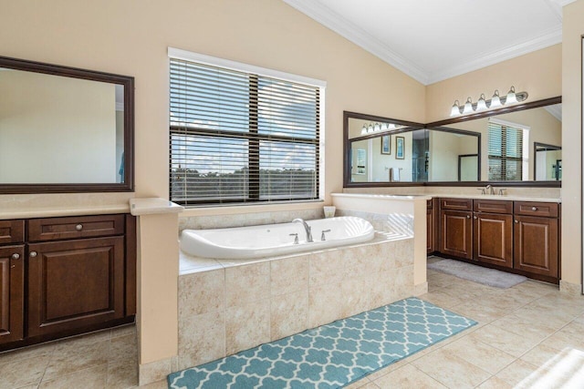 bathroom featuring vanity, tile patterned floors, ornamental molding, and tiled bath