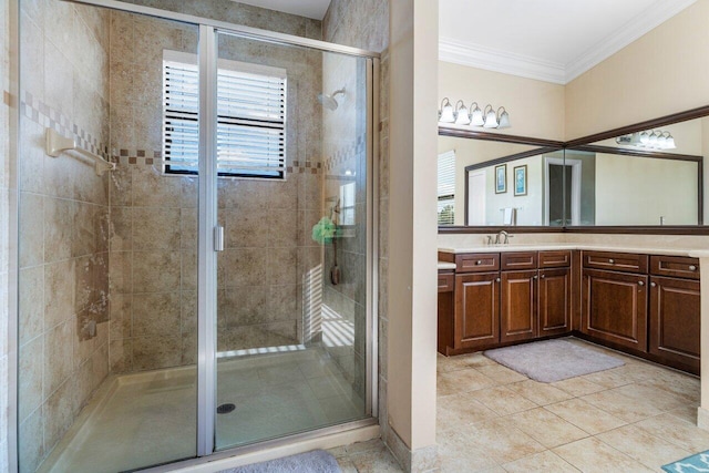 bathroom with ornamental molding, an enclosed shower, tile patterned flooring, and vanity