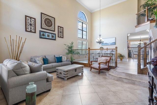 tiled living room with a towering ceiling, ornamental molding, and a chandelier